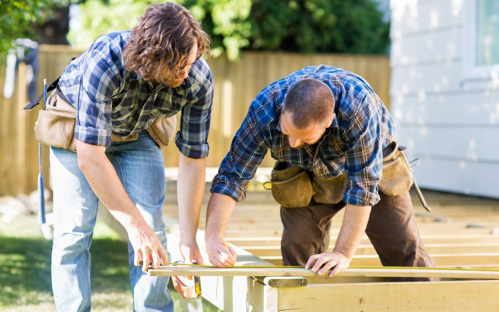 Measuring a deck board for glass railing